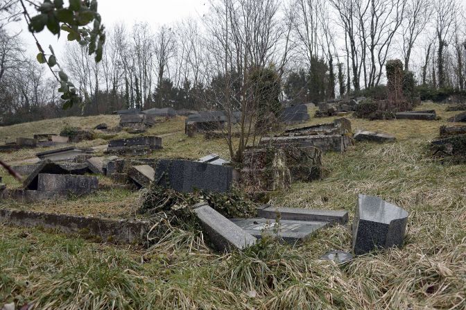 Toppled and shattered matzeivos in a vandalized French Jewish cemetery