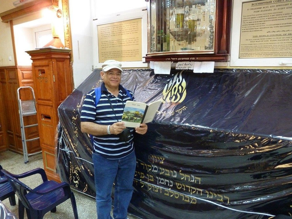 A visitor davening at the kever of Rebbe Nachman